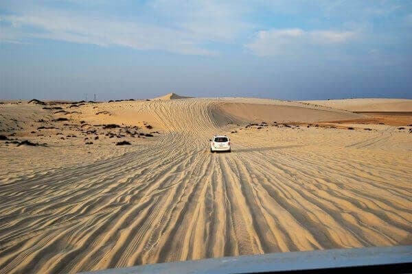 Golden Rasmouka sand dunes stretching to the horizon near Agadir, Morocco